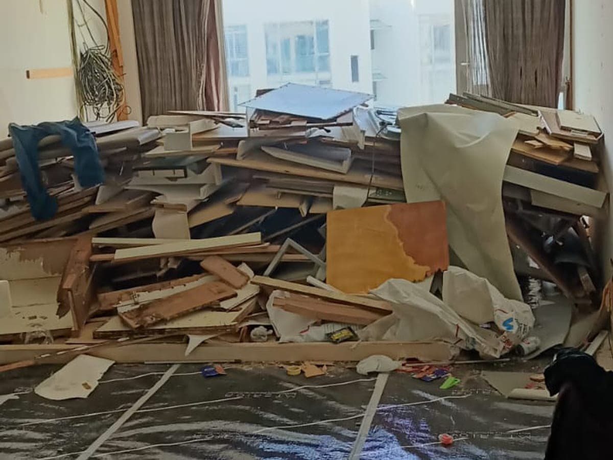 Covered floor area with dismantled materials during demo works