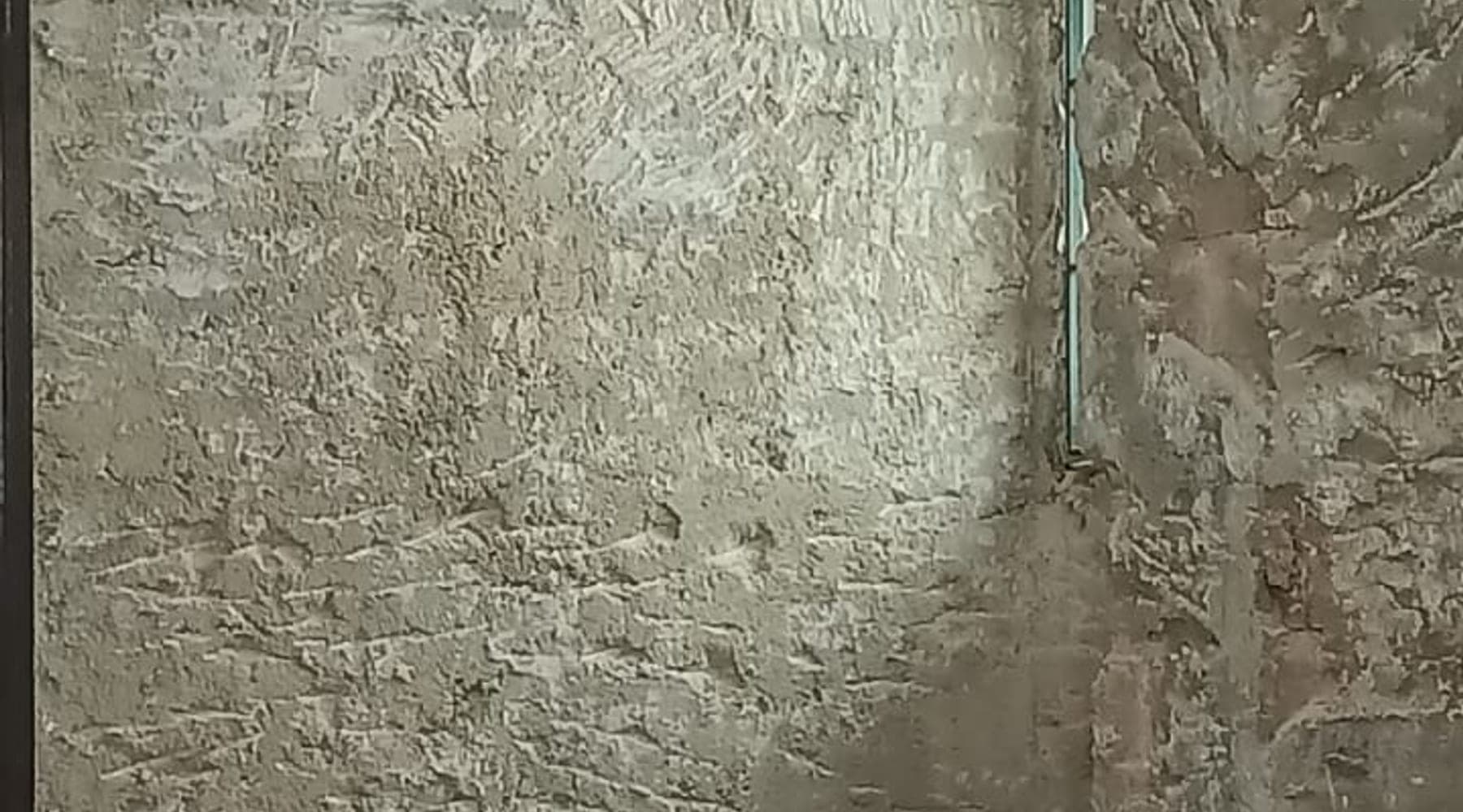 Exposed hacked wall surface during JBC demo works