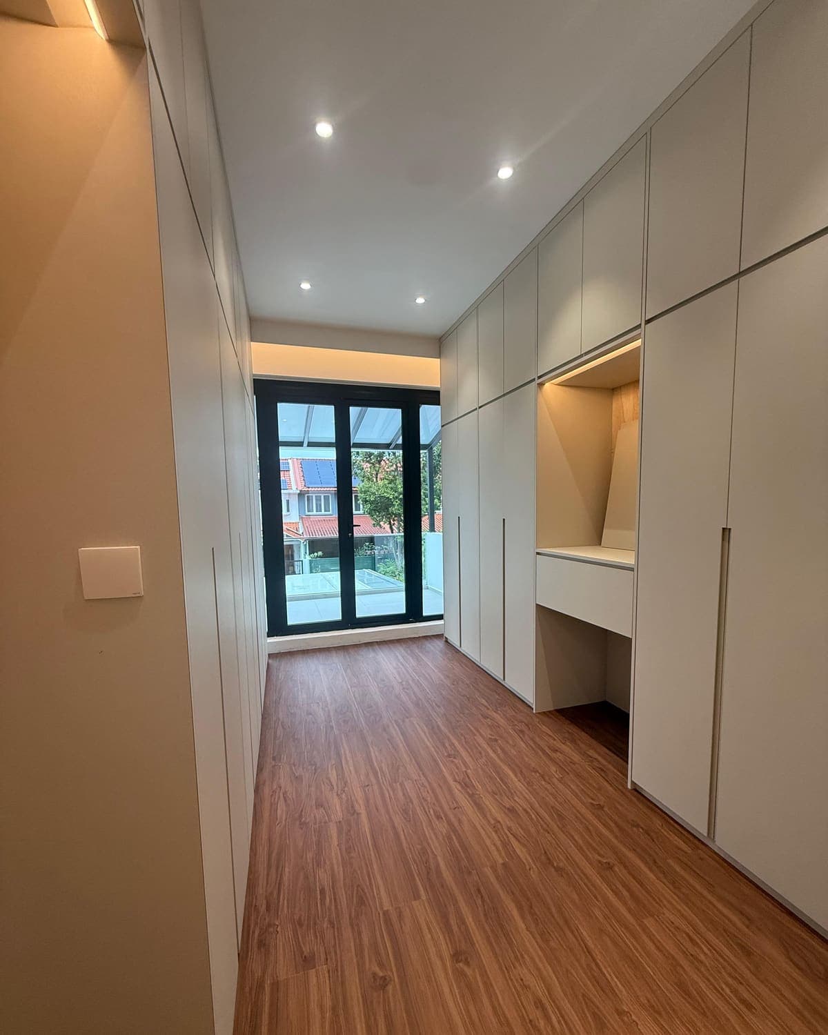 White wardrobe carpentry with sliding doors and internal storage